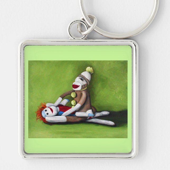 Smutsa ner sockor fyrkantig silverfärgad nyckelring (Framsidan)