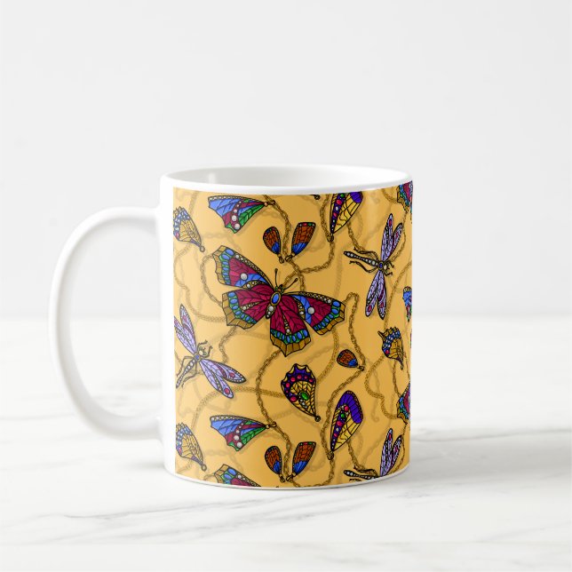 Smycken och drakar på gult kaffemugg (Vänster)
