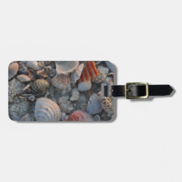 Snäckor på sanden bagagebricka