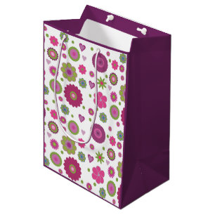 Snazzy lila och grön blommönster på vit