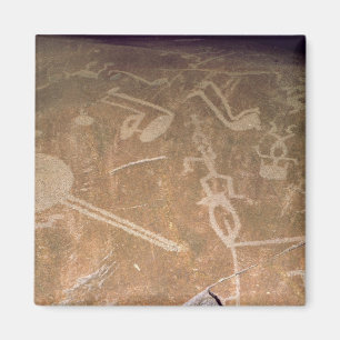 Sniden petroglyph som visar figurer magnet