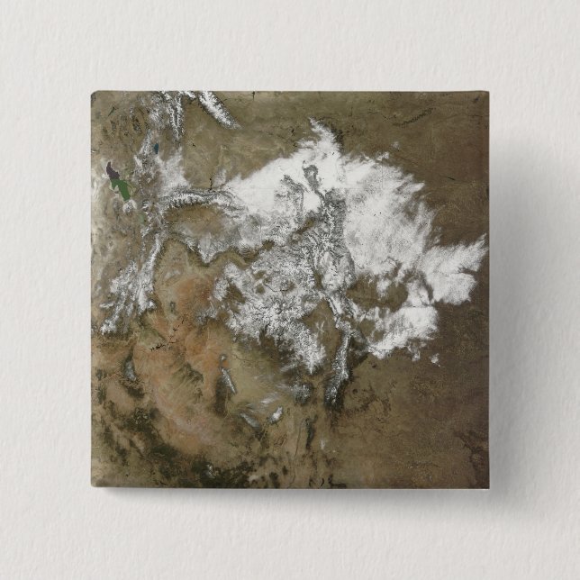 Snö omfattar Rocky mountains i Förenta staterna Knapp (Framsida)