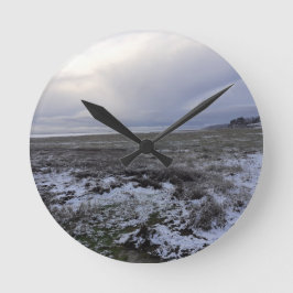 Snö över bukten rund klocka