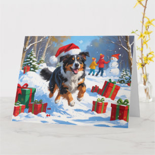 Snö-scenen i australian shepherd vid julfesten kort