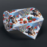 Snö-scenen i australian shepherd vid julfesten slips<br><div class="desc">En helgdag med hjärtslitande hund i snö,  som bär en julhatt och omges av färgfulla presentlådor. I bakgrunden bygger barn snögubbe bredvid ett Julgran som är täckt av snö och skapar en glatt vinter under. Perfekt för att sprida helgdag och fånga julens magi.</div>