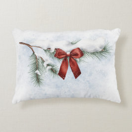 snö-täckt gräs gren med fetiös röd båge prydnadskudde