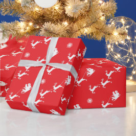Snöflinga och tomte med släde på röd julbakgrund presentpapper