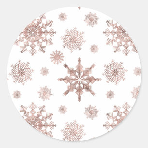 Snöflingemönster i falsk roséguldfärg runt klistermärke
