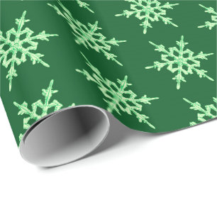 Snöflingor, kristaller för blek grönt på mörk grön presentpapper