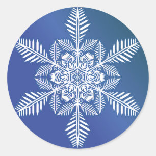 Snöflingor över blåmärke runt klistermärke