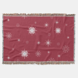 Snöflingor på den röda kastfilten mysfilt