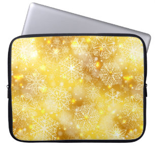 Snöflingor på golden laptop fodral