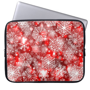 Snöflingor på rött laptop fodral