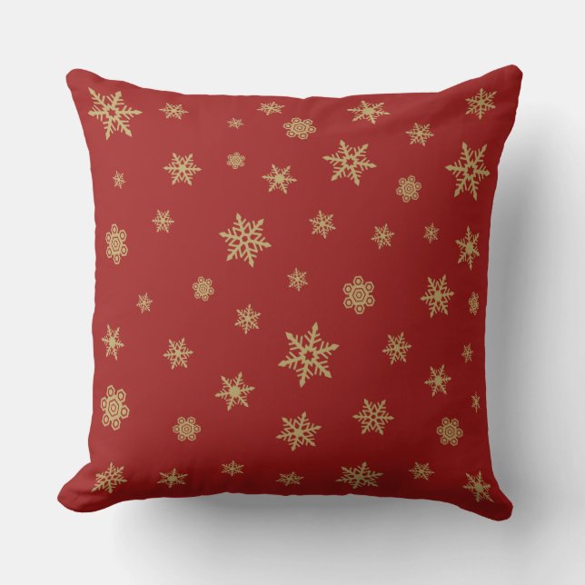 Snöflingordesignguld på rött kudde (Framsida)