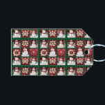 Snögubbar Collage Presentetikett<br><div class="desc">Späda snögubbar i hattar och halsdukar,  som är sammanflätade med vita blommor och grenar mot gröntens bakgrund,  skapar en roligtens kollage som är perfekt för dina helgdag.</div>
