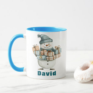Snögubbe Holding Julklapp Blue Hat Mugg