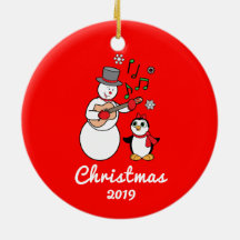 Snögubbe med gitarr- och pingvinårsanpassade