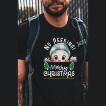 Snögubbe mellan Julgran