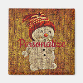 Snögubbe på den skumma, rustiska vintern magnet