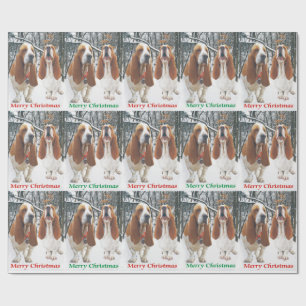 Snöig Bassethundgod jul som slår in papper Presentpapper