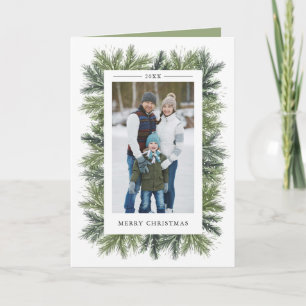 Snöig kort för hälsning för gräsjulfoto