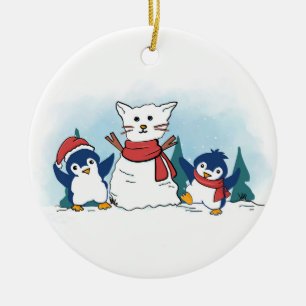 Snöiga pingviner bygger en jul snö katt julgransprydnad keramik