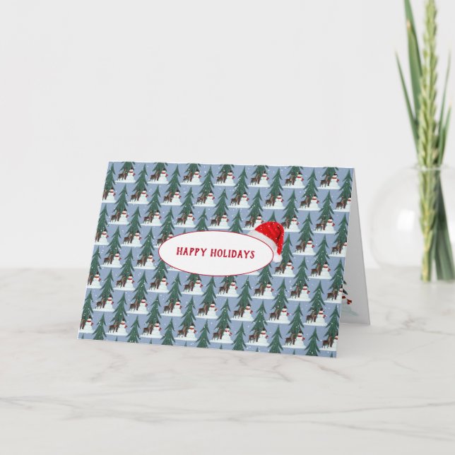 snöman och hjort i snöflingor på blå helgkort (Framsida)