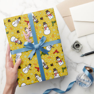 Snömän och snöflingor på guld presentpapper