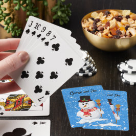 Snömannen står medan snö faller casinokort