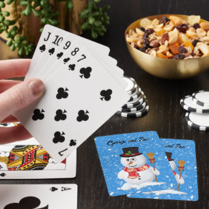 Snömannen står medan snö faller casinokort