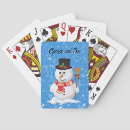 Snömannen står medan snö faller casinokort