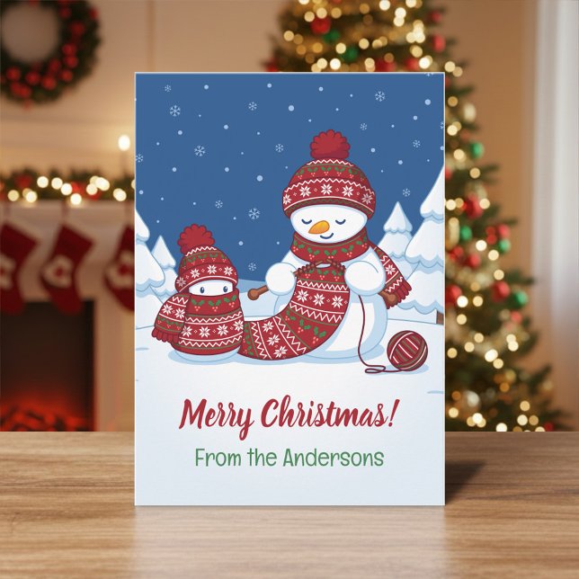 Snömannen stickar julskärp från familjen julkort (Skapare uppladdad)