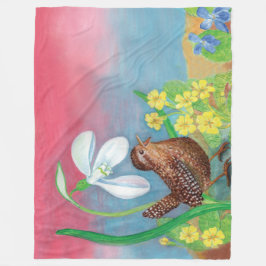 Snovdroppen och den bruna fågeln vid vår fleecefilt