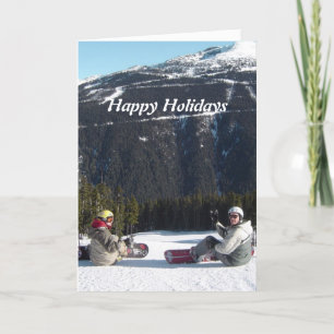 Snowboardåkare med en naturskön bergsutsikt helgkort