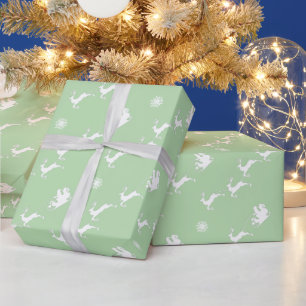 Snowflake och Santa med Sleigh på Ljust grönt Presentpapper