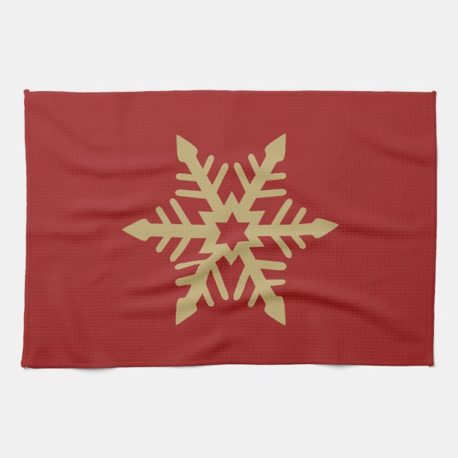 Snowflakedesignguld på rött kökshandduk (Horisontell)
