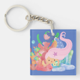 Snygg ROSA HAIR-sjöjungfru som leker kramande fisk