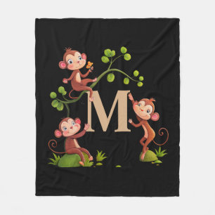 Snygga söta apor, gyllene monogram på svart fleecefilt