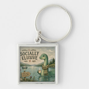 Socialt undvikande Nessie mysig kryptid Loch Ness Fyrkantig Silverfärgad Nyckelring