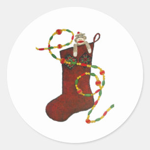 Sock monkey-julklapp runt klistermärke