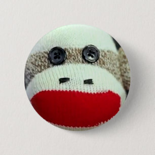Sock monkey klämmer fast knapp