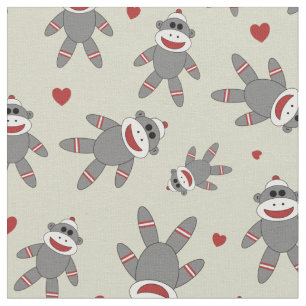 Sock monkey med örhängen på Tan Tyg