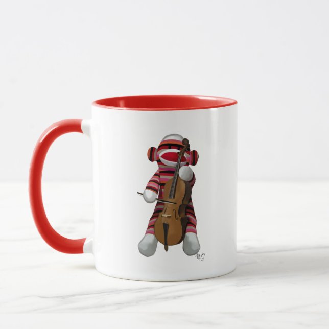 Sock monkey och Cello Mugg (Vänster)