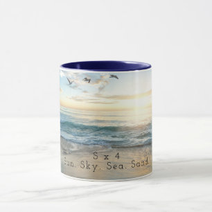 Sol. Himmel. Hav. Sand. Mugg