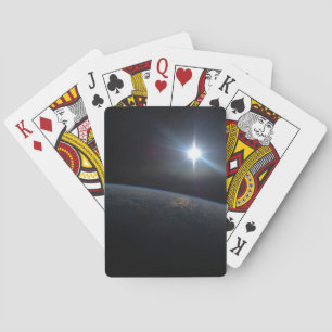 Sol sätter sig över jordens Horisont. Casinokort
