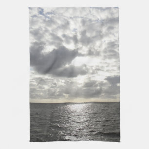 Sol som skiner genom moln kökshandduk