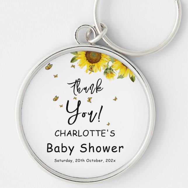 Solblommor och fjärilar, babykläder rund silverfärgad nyckelring (Framsidan)