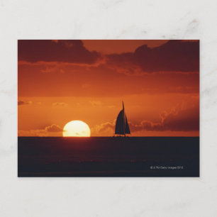 Solnedgång och yacht 2 vykort