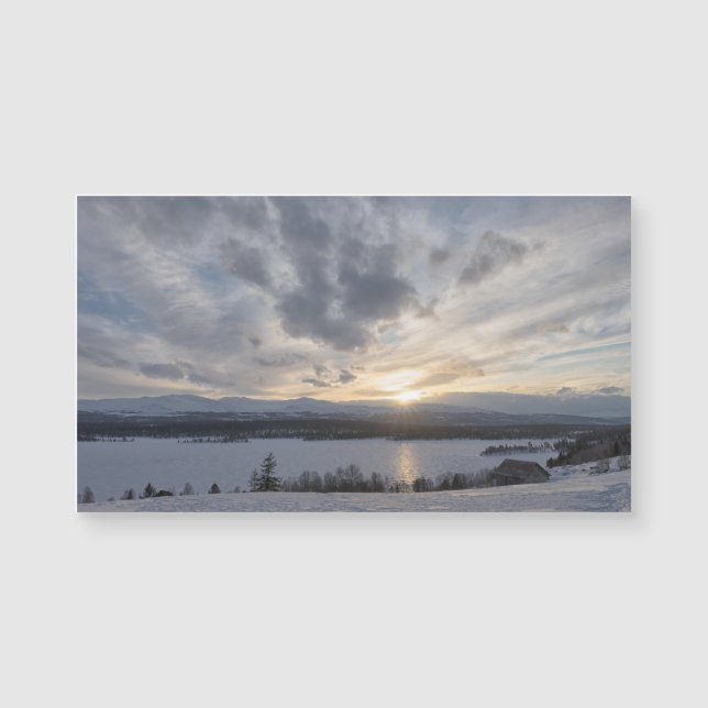 Solnedgång över fryst sjö (Framsida)