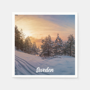 Solnedgång över fryst snöskog nära havet pappersservett